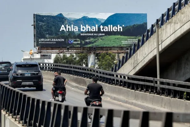 A billboard welcoming tourists is seen along the airport road in Beirut on June 22, 2022. ANWAR AMRO/AFP via Getty Images

 