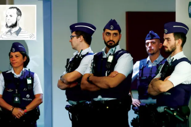 ضباط شرطة خارج قاعة الجلسة التمهيدية لمحاكمة هجمات بروكسل أمس (إ.ب.أ)  -  الفرنسي صلاح عبد السلام المحكوم عليه بالسجن مدى الحياة في فرنسا رفض المثول أمام المحكمة (أ.ب)