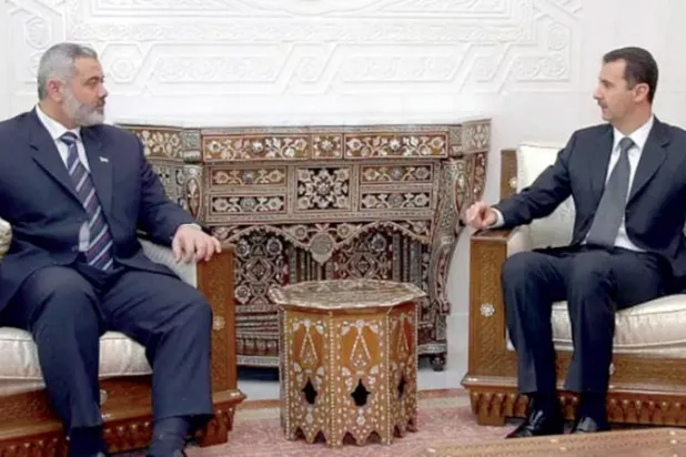 صورة أرشيفية للأسد وهنية في لقاء قبل بدء النزاع السوري عام 2011