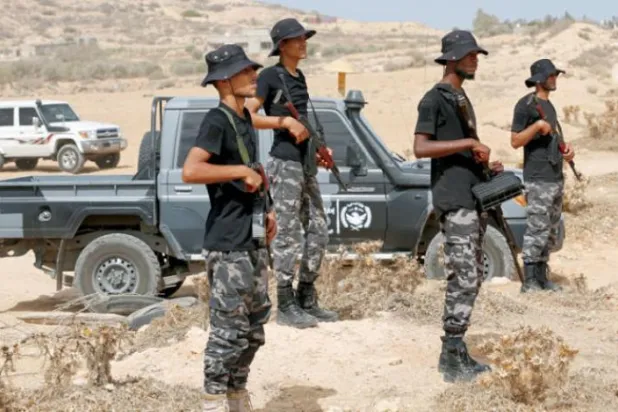 Fighters affiliated with the Dbeibeh government train on securing Tripoli, Libya (AP)