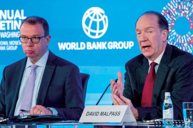 رئيس البنك الدولي خلال أحد الاجتماعات الخاصة بالبنك وصندوق النقد الدولي أمس (إ.ب.أ)