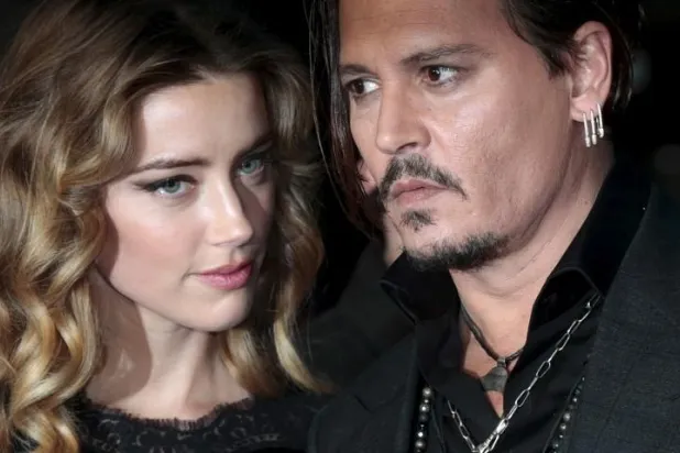 الممثل الأميركي جوني ديب وزوجته السابقة آمبر هيرد (رويترز)