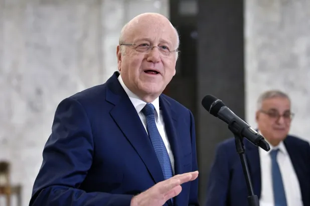 Lebanese caretaker Prime Minister Najib Mikati speaks during a news conference after a meeting with Lebanese President Michel Aoun (not pictured) at the presidential palace in Baabda, Lebanon, 11 October 2022. (EPA)
