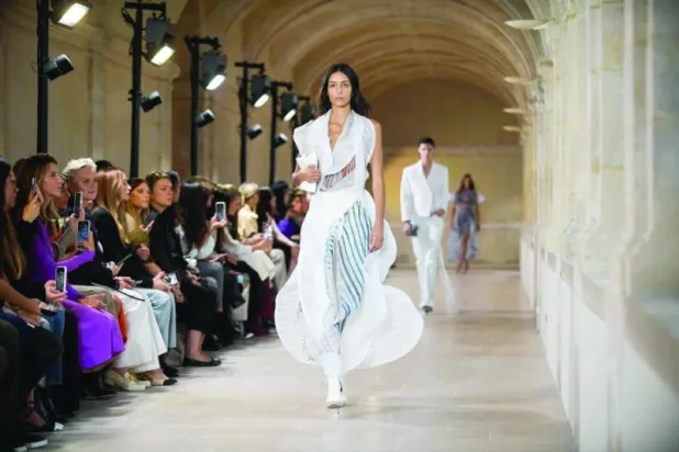 لا تُخفي المصممة أن مشاركتها في أسبوع باريس يعتبر نقلة مهمة في مسيرتها (أ.ف.ب)