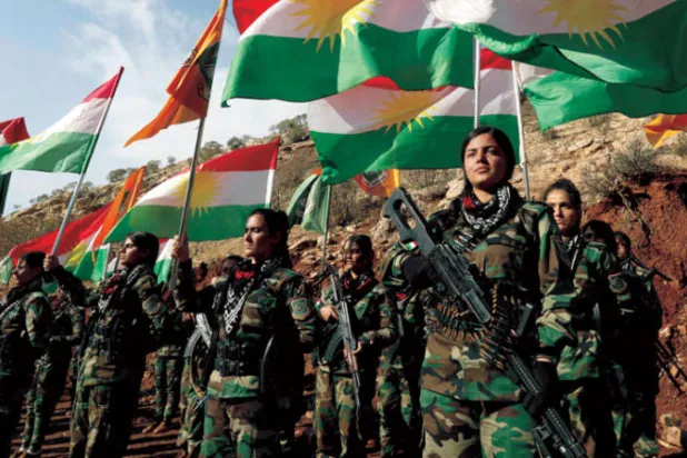 صورة وزعت مطلع ديسمبر لمقاتلات من البيشمركة في قاعدة لم يكشف عنها في محافظة أربيل (أ.ف.ب)
