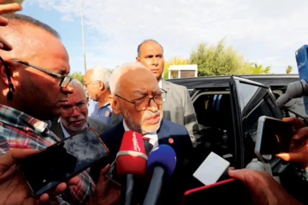 Gannuşi, 21 Eylül'de Tunus Terörle Mücadele Savcılığı’ndan ayrıldığı sırada gazetecilere açıklamalarda bulundu. (EPA)