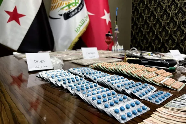 Seized drugs, including Captagon, are displayed for the media in the town of Marea, in the northern Aleppo countryside, on May 24, 2022, following clashes among different Türkiye-backed factions in Syria. (AFP)