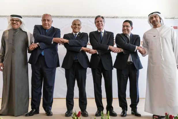 Closing their talks at the Negev Summit, (from left) Bahrain's Foreign Minister Abdullatif bin Rashid al-Zayani, Egypt's Foreign Minister Sameh Shoukry, Israel's Foreign Minister Yair Lapid, US Secretary of State Antony Blinken, Morocco's Foreign Minister Nasser Bourita, and United Arab Emirates' Foreign Minister Sheikh Abdullah bin Zayed Al Nahyan, pose for a photograph, March 28, 2022, in Sde Boker, Israel. (AP)
