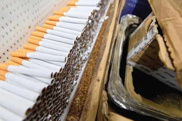 التقرير يؤكد ضرورة تراجع معدلات التدخين بمعدل أسرع (أ.ف.ب)