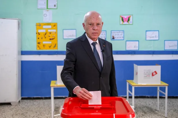 Tunisia's President Kais Saied casts his ballot at a polling station during parliamentary elections in Tunis, Tunisia December 17, 2022. (Tunisian Presidency/Handout via Reuters)