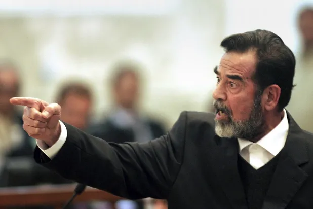 Former Iraqi president Saddam Hussein gestures during his trial in Baghdad, Iraq, Jan. 29, 2006. (AP)