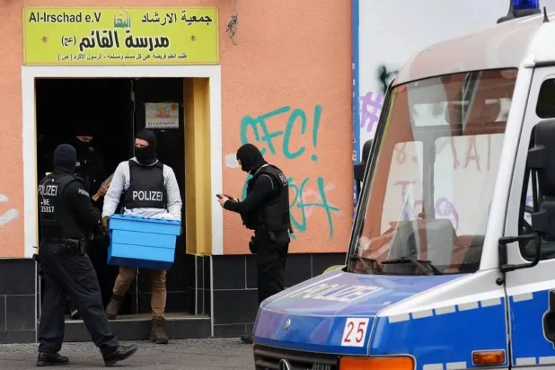 German police transfer materials from the headquarters of the Irshad Association in Berlin, after the decision to ban Hezbollah in 2020. (EPA) 