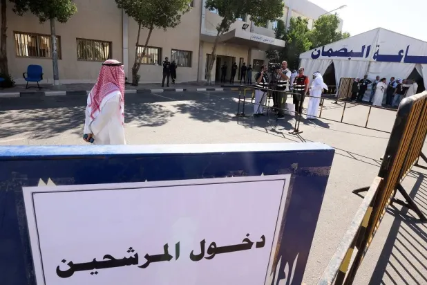 Kuwaiti candidates arrive at the interior ministry's electoral affairs department to register for the upcoming parliamentary election in Kuwait City, on May 6, 2023. (AFP)