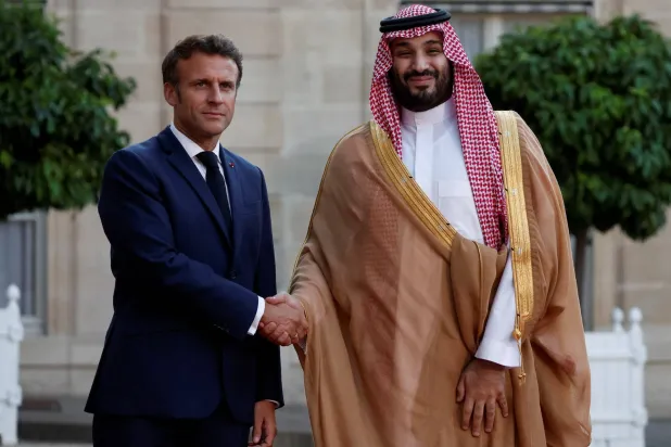 French President Emmanuel Macron and Saudi Crown Prince Mohammed bin Salman shake hands ahead of a working dinner at the Elysee Palace in Paris, France, July 28, 2022. REUTERS/Benoit Tessier