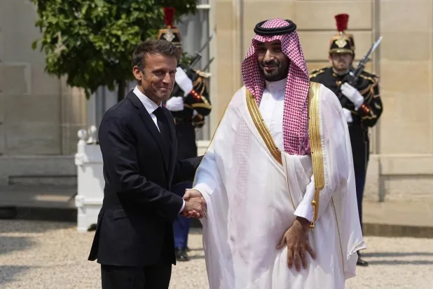 French President Emmanuel Macron receives Saudi Crown Prince Mohammed bin Salman at the Elysee Palace in the capital city of Paris last Friday (AP)