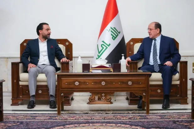 Maliki (sağda) ve Halbusi (Irak Meclisi)