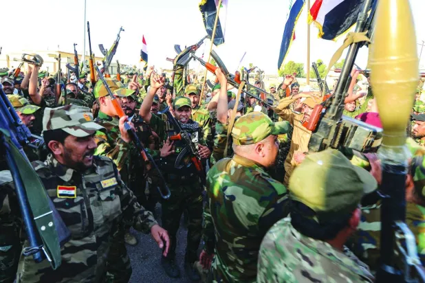  Irak'ın kuzeyindeki Hatra bölgesinde Halk Seferberlik Güçleri'nin (Haşdi Şabi) kuruluşunun dokuzuncu yıl dönümü kutlamaları geçen hafta düzenlendi. (AFP)