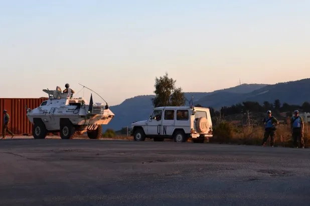 Vehicles and members of the United Nations Interim Forces in Lebanon (UNIFIL) patrol along the border with the northern Israeli town of Metula, in Kafr Kila, southern Lebanon, 12 July 2023. (EPA)