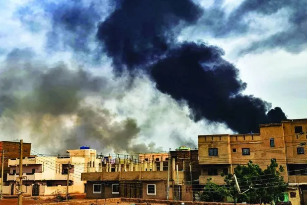 Smoke columns rise as a fire engulfs a gas warehouse near the Yarmouk factory, south of Khartoum, Sudan. (AFP) 