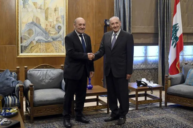 Lebanese parliament Speaker Nabih Berri (R) shakes hands with Jean-Yves Le Drian (L), the former French foreign minister and special envoy for Lebanon, at Berri's house in Beirut, Lebanon, 25 July 2023. (EPA) 