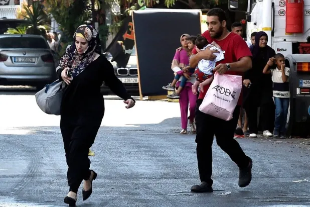 People fleeing the Ain al-Hilweh refugee camp