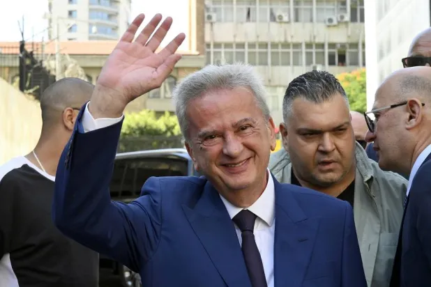 Lebanon's Central Bank Governor, Riad Salameh (C), greets employees on his last working day as the head of the Central Bank in Beirut, Lebanon, 31 July 2023. (EPA)