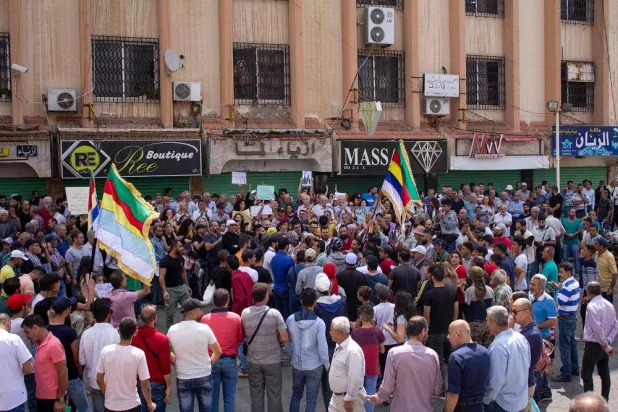 A handout picture released by the Suwayda24 news site shows people protesting in the southern Syrian city of Sweida on August 29, 2023. (Suwayda24/ AFP) 