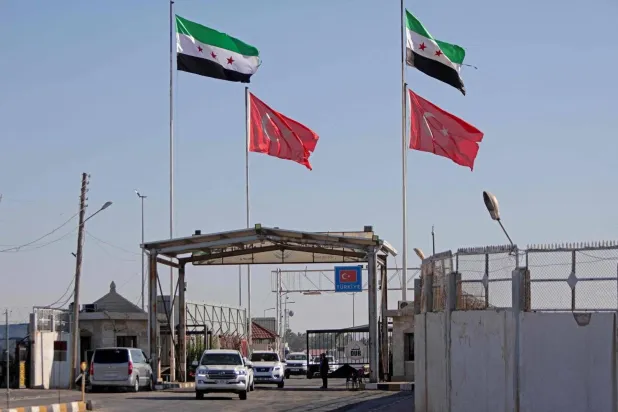 A convoy carrying US politicians at the Bab al-Salameh border crossing between Türkiye and Syria during an inspection visit to northern Syria in August (AFP)