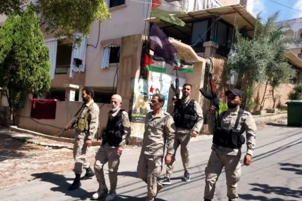 صورة لعناصر من القوة الأمنية في عين الحلوة (الوكالة الوطنية)