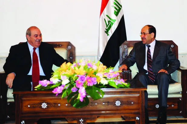 Allawi and Al-Maliki in one of their meetings in Baghdad in 2010 (Getty)
 
