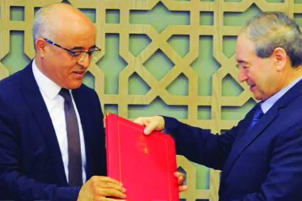 المقداد يتسلم نسخة من أوراق اعتماد السفير التونسي محمد المهذبي (سانا)