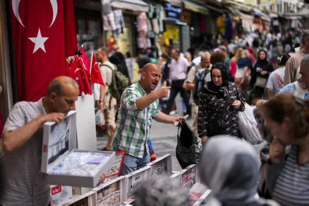 Shoppers in a market in Istanbul. (AP) 

