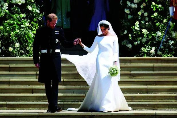 ميغان ماركل اعتمدت أسلوب «باردو» في فستان زفافها أيضاً (غيتي)