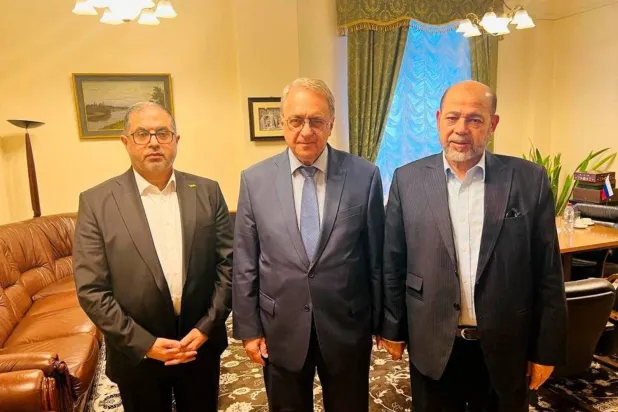 Russian Deputy Foreign Minister Mikhail Bogdanov with Hamas leaders Musa Abu Marzouk and Bassem Naim in Moscow (Reuters)
