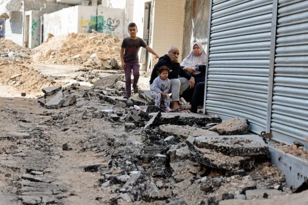 A damaged road after Israeli forces stormed the Jenin camp in the West Bank on Sunday (Reuters)