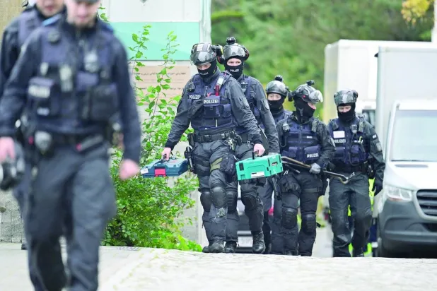 German police walk at the Islamic Center Hamburg grounds during a raid in Hamburg, Germany, November 16, 2023. REUTERS/Fabian Bimmer
