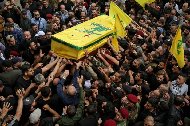 Mourners are seen at the funeral procession of a Hezbollah fighter who was killed in clashes with Israel. (dpa) 