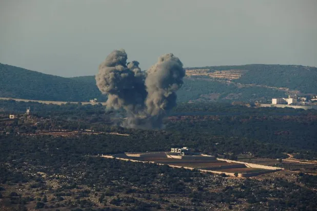 Smoke rises on the Lebanese side of the border between Israel and Lebanon after an Israeli airstrike, as seen from northern Israel, November 18, 2023. (Reuters)