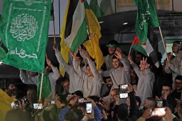 Prisoners are released in Beitunia near Ramallah on Friday. (AF)