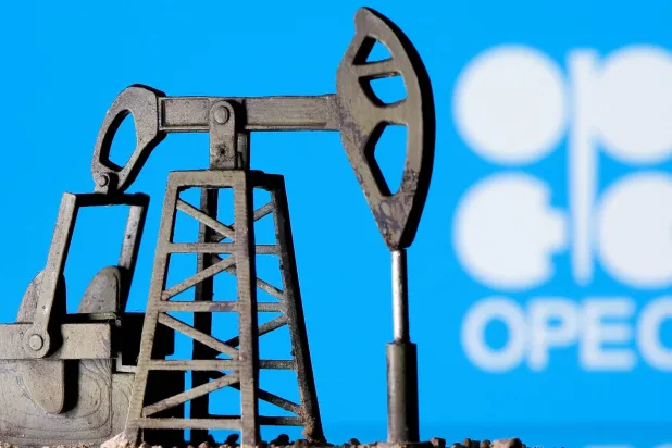 A 3D-printed oil pump jack is seen in front of the OPEC logo (File Photo: Reuters)
