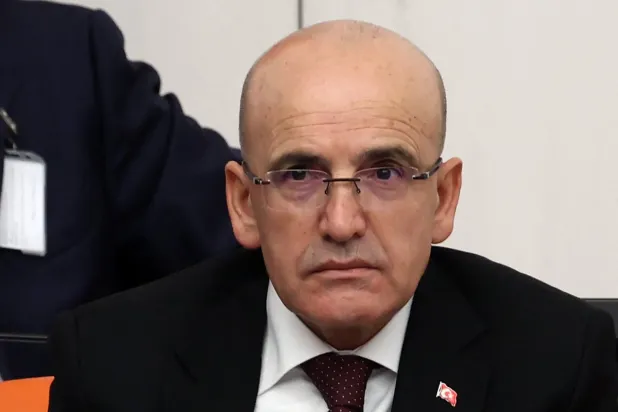 وزير الخزانة والمالية التركي محمد شيمشك في مؤتمر صحافي سابق (أ.ف.ب)