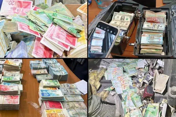 صورة وزعها الجيش الإسرائيلي للأموال المصادرة من محلات الصرافة في الضفة