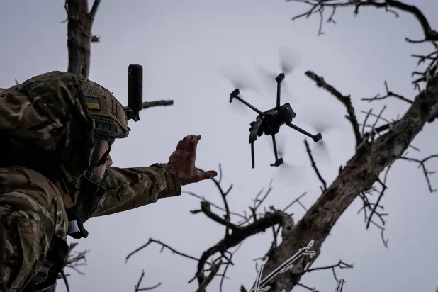  A Ukrainian soldier launches a drone during battles in Bakhmut. (Reuters)