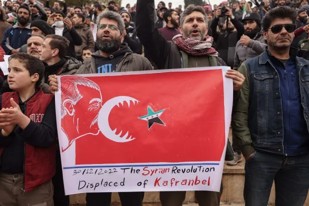 30 December 2022, Syria, Idlib city: Syrians take part in a demonstration against potential rapprochement between Türkiye and the Syrian government, after the Russian, Syrian, and Turkish defense ministers met in Moscow on Wednesday for talks for the first time since the war broke out in Syria in 2011. (dpa) 