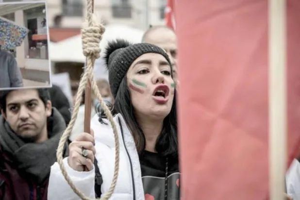 A woman carries a noose during a rally against the Iranian regime in Paris last week (AFP)