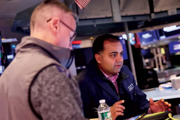 فتحت بورصة نيويورك على تراجع أمس مع نتائج مخيبة لبنك غولدمان ساكس (أ.ف.ب)