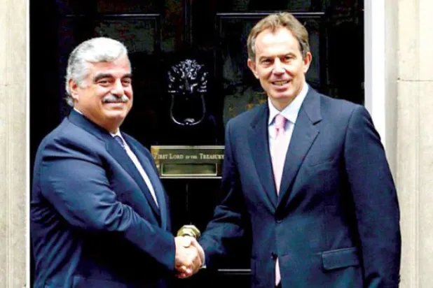 Blair and Hariri shake hands in front of the Prime Minister’s residence at 10 Downing Street, in a meeting that brought them together on July 29, 2003. (Getty Images)