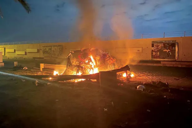 السيارة التي كان يستقلها سليماني مشتعلة بعد استهدافها بصواريخ أميركية قبل عامين (أ.ف.ب)