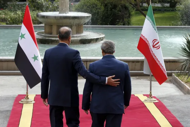 Iranian foreign minister Hossein Amir-Abdollahian (L) greets his Syrian counterpart Faisal Mekdad (R) in Tehran, Iran, 02 November 2022. (EPA)