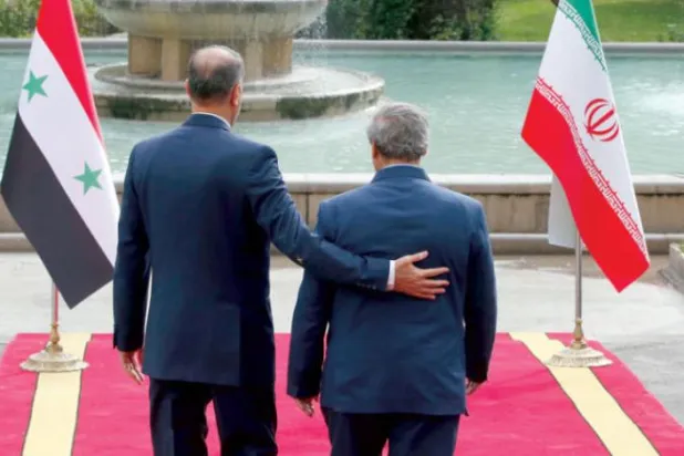 İran Dışişleri Bakanı Abdullahiyan (solda), Suriyeli mevkidaşı Mikdad ile geçen kasım ayında Tahran’da bir araya geldi. (EPA)